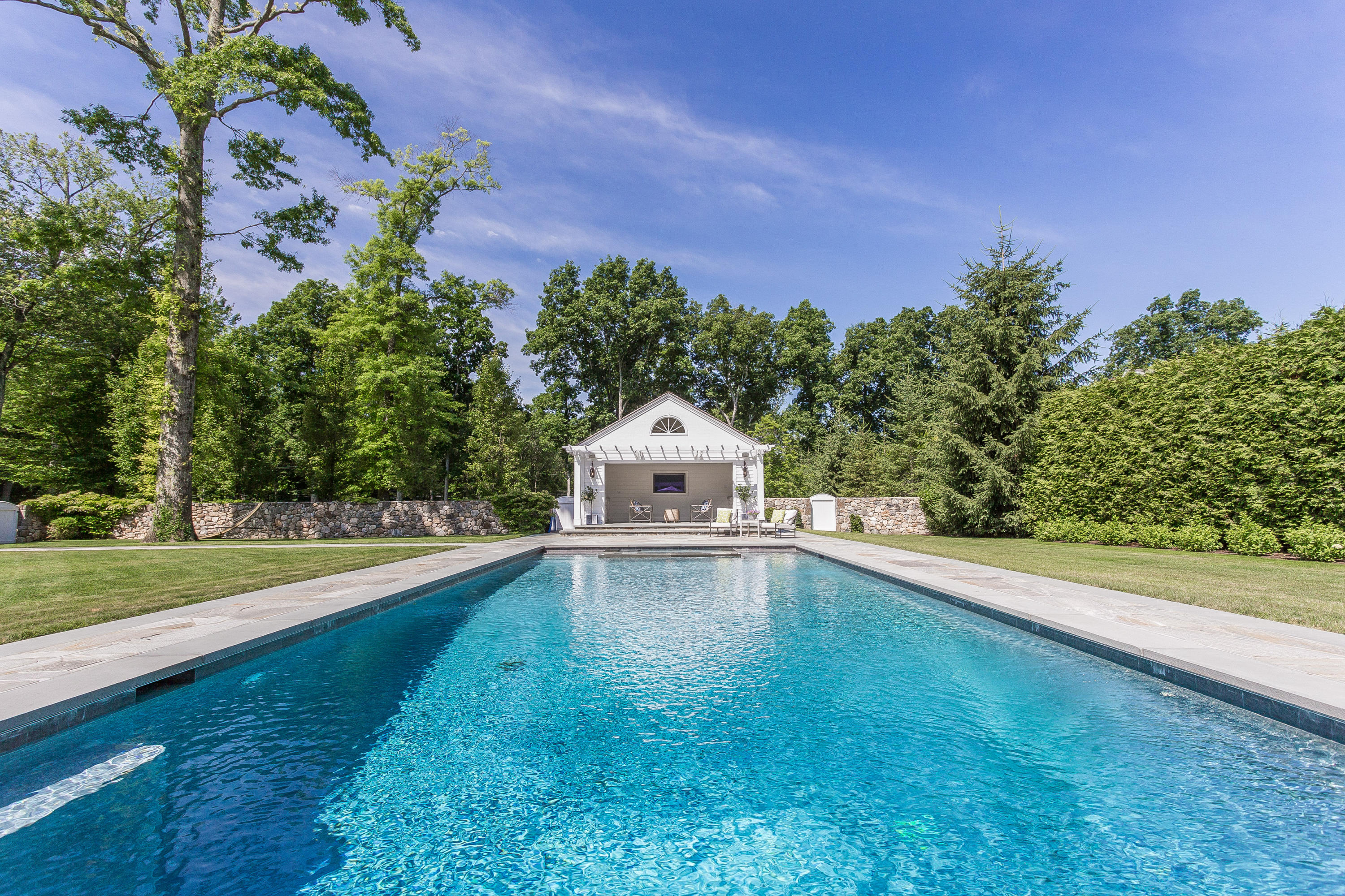 256 Brookside Road Darien, CT 06820 - Photo 36 of 66 a view of a mini pool with a yard