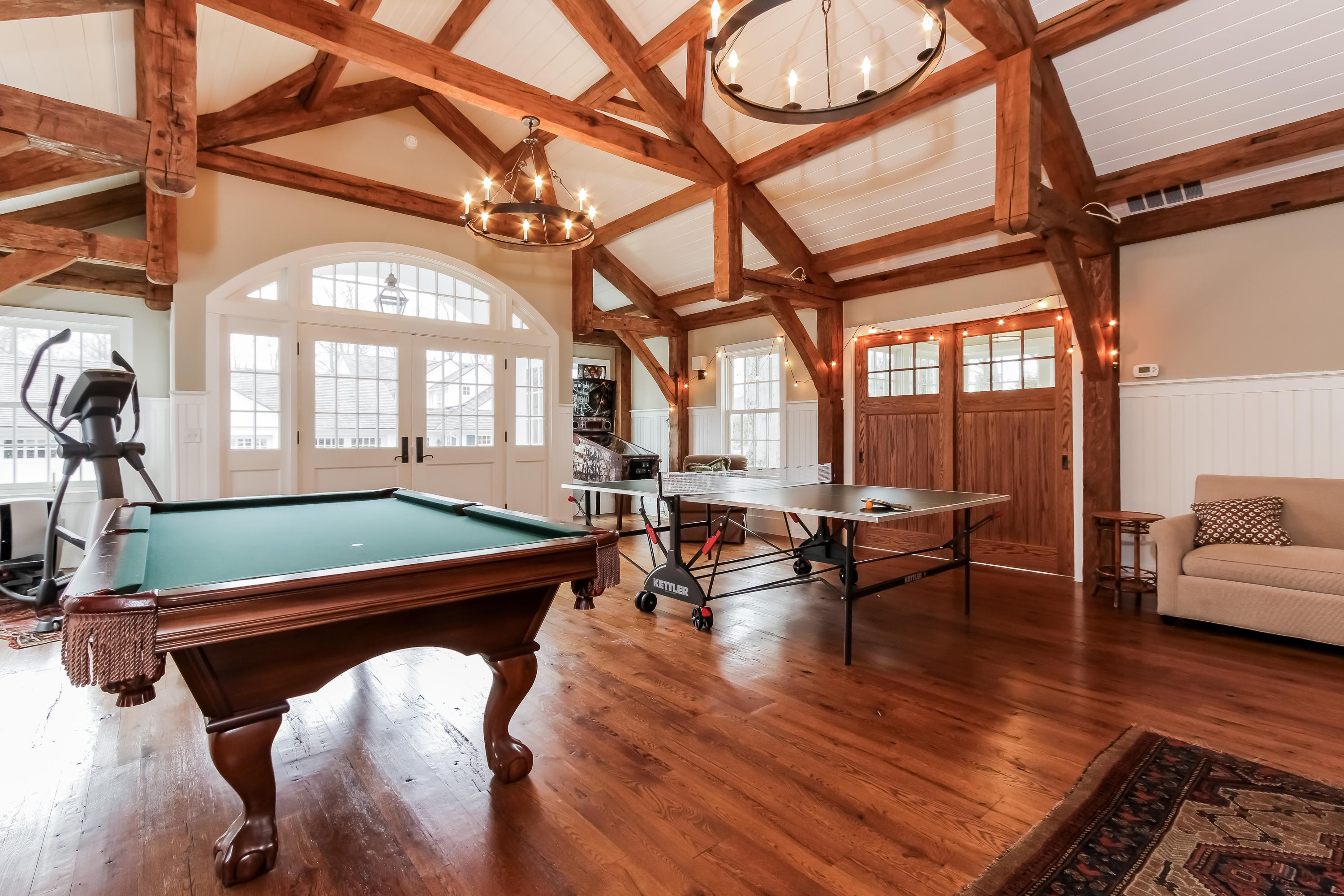 256 Brookside Road Darien, CT 06820 - Photo 43 of 66 a living room with furniture a large window and wooden floor