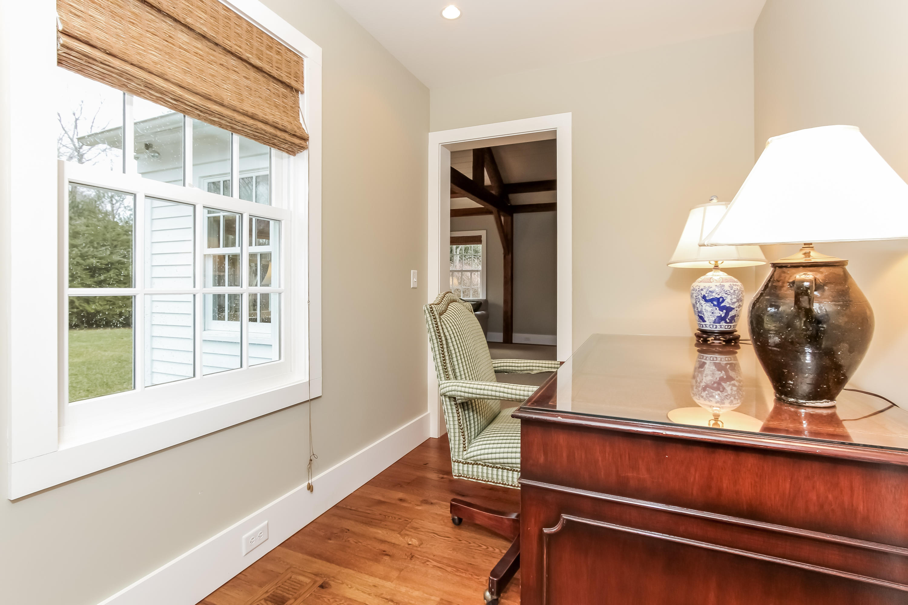 256 Brookside Road Darien, CT 06820 - Photo 49 of 66 a living room with a bed furniture and a window