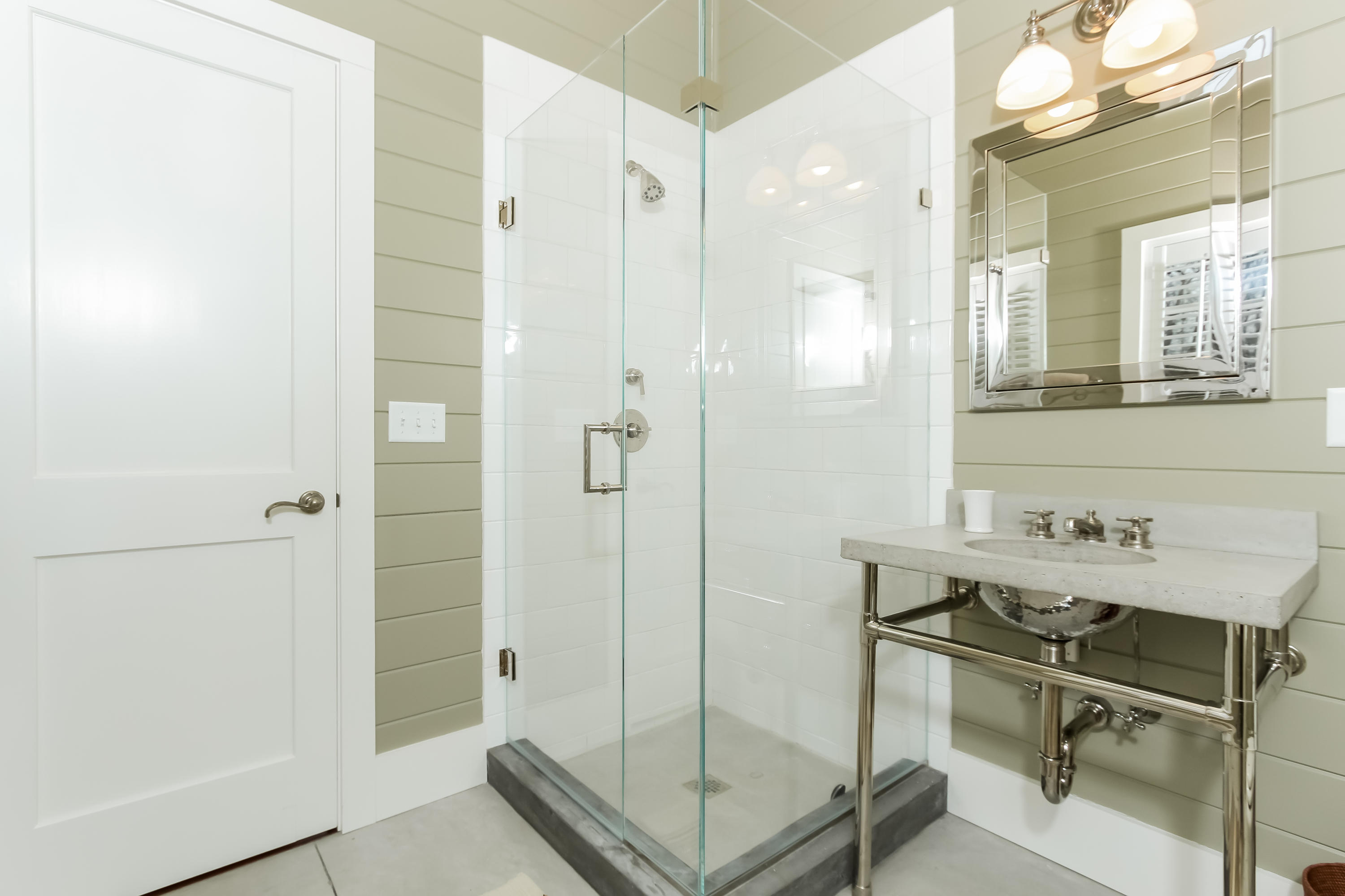 256 Brookside Road Darien, CT 06820 - Photo 50 of 66 a bathroom with a shower sink and mirror