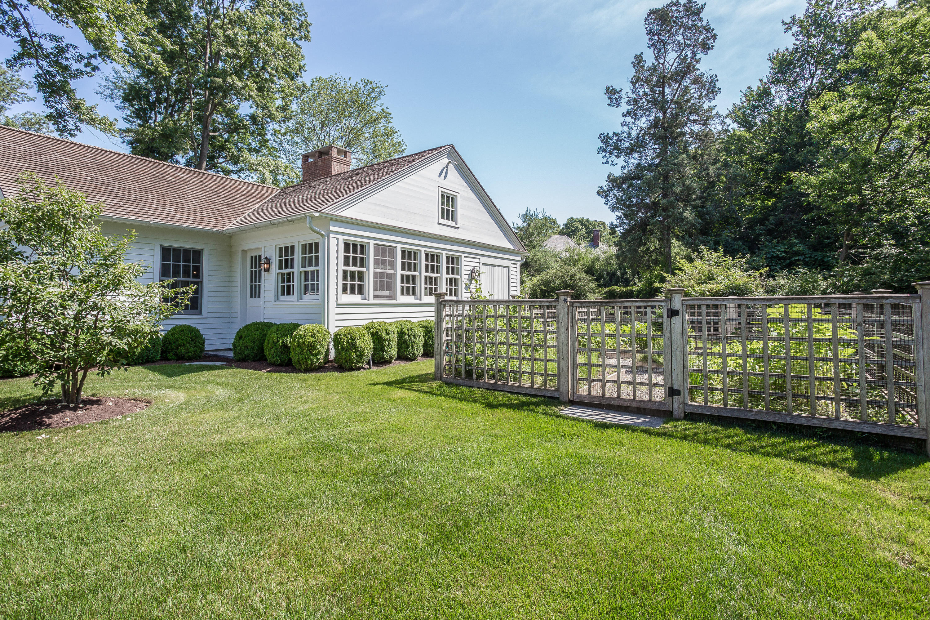 256 Brookside Road Darien, CT 06820 - Photo 51 of 66 a view of a house with a yard and sitting area