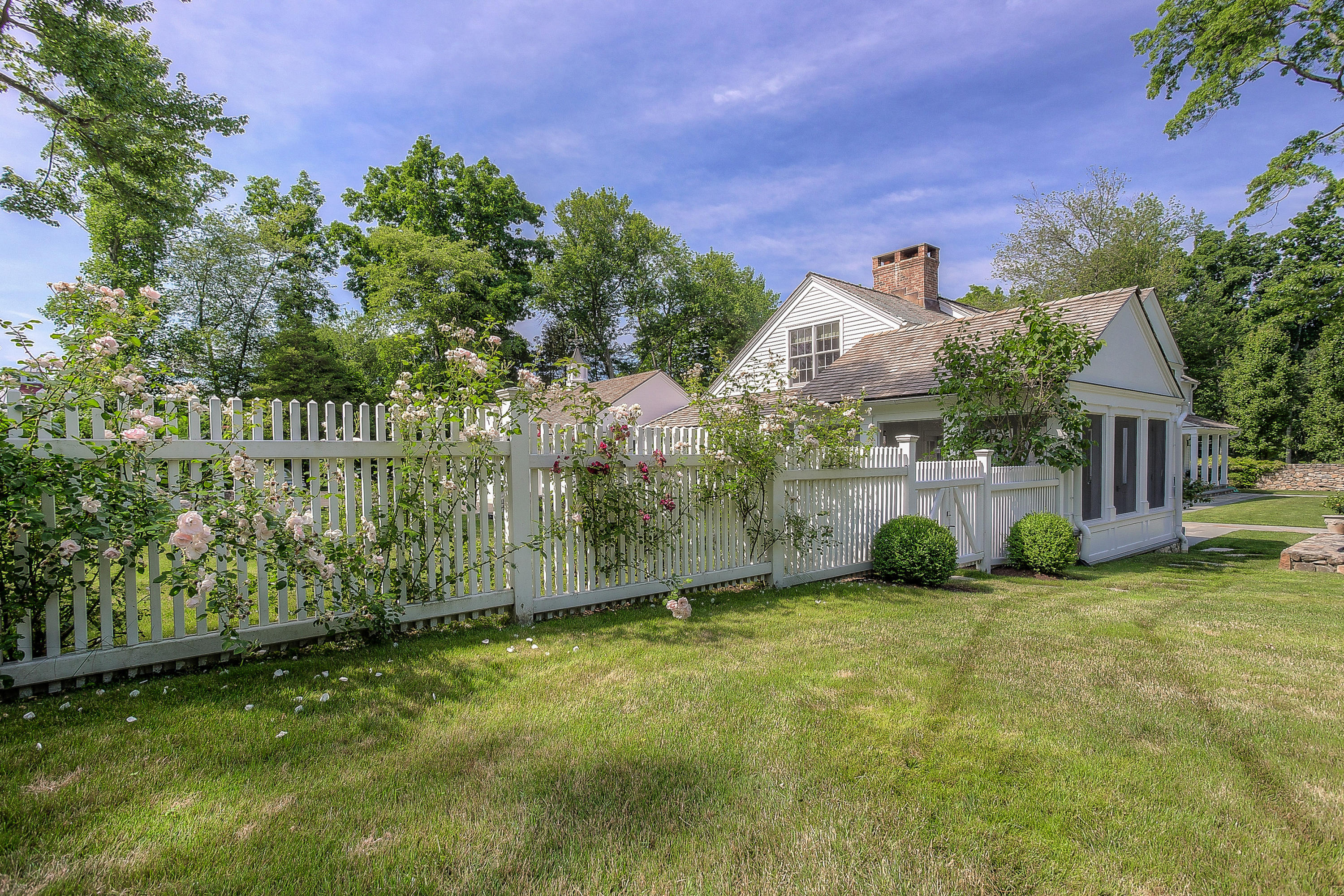 256 Brookside Road Darien, CT 06820 - Photo 53 of 66 a view of a garden with a slide