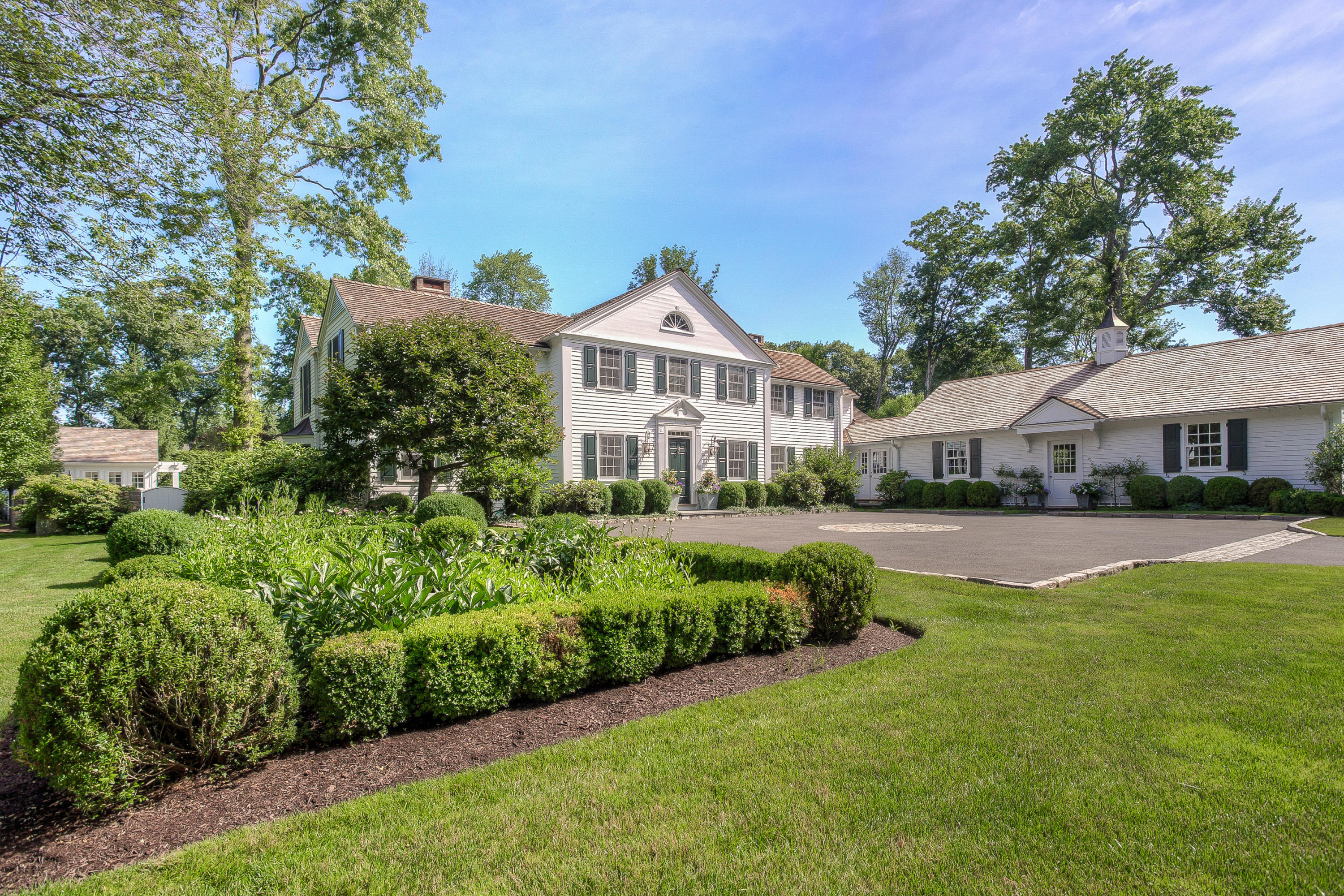 256 Brookside Road Darien, CT 06820 - Photo 7 of 66 a front view of a house with a yard
