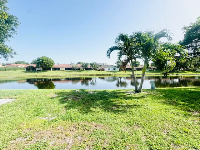 a view of a lake with a big yard