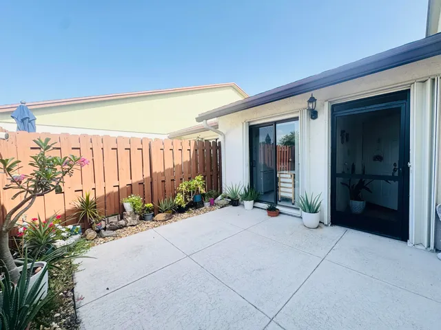 a lobby with a potted plant and a potted plant