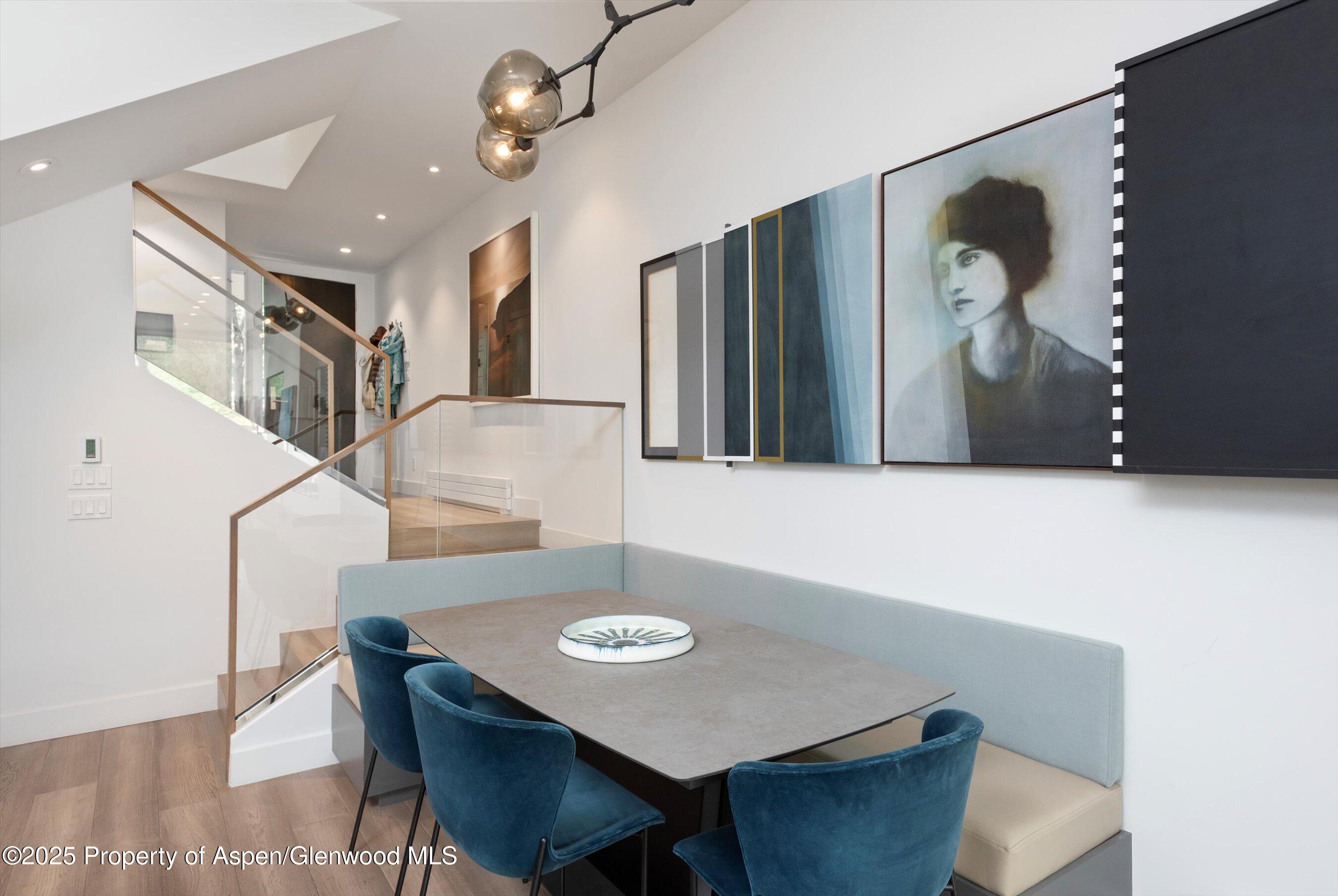 155 Lone Pine Road, Unit 8 Aspen, CO 81611 - Photo 11 of 36 a view of a dining room with furniture and wooden floor