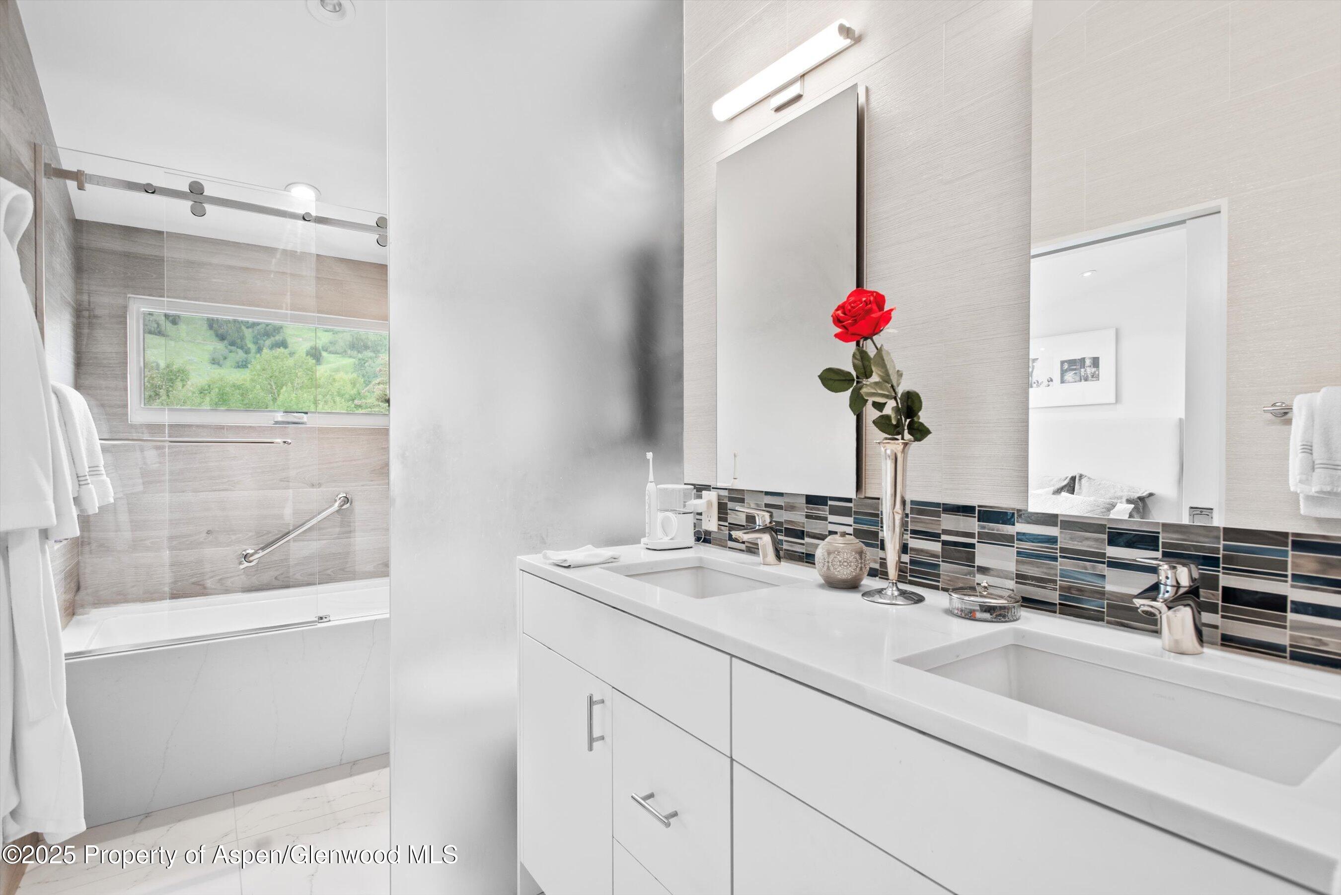 155 Lone Pine Road, Unit 8 Aspen, CO 81611 - Photo 24 of 36 a bathroom with a sink and a mirror
