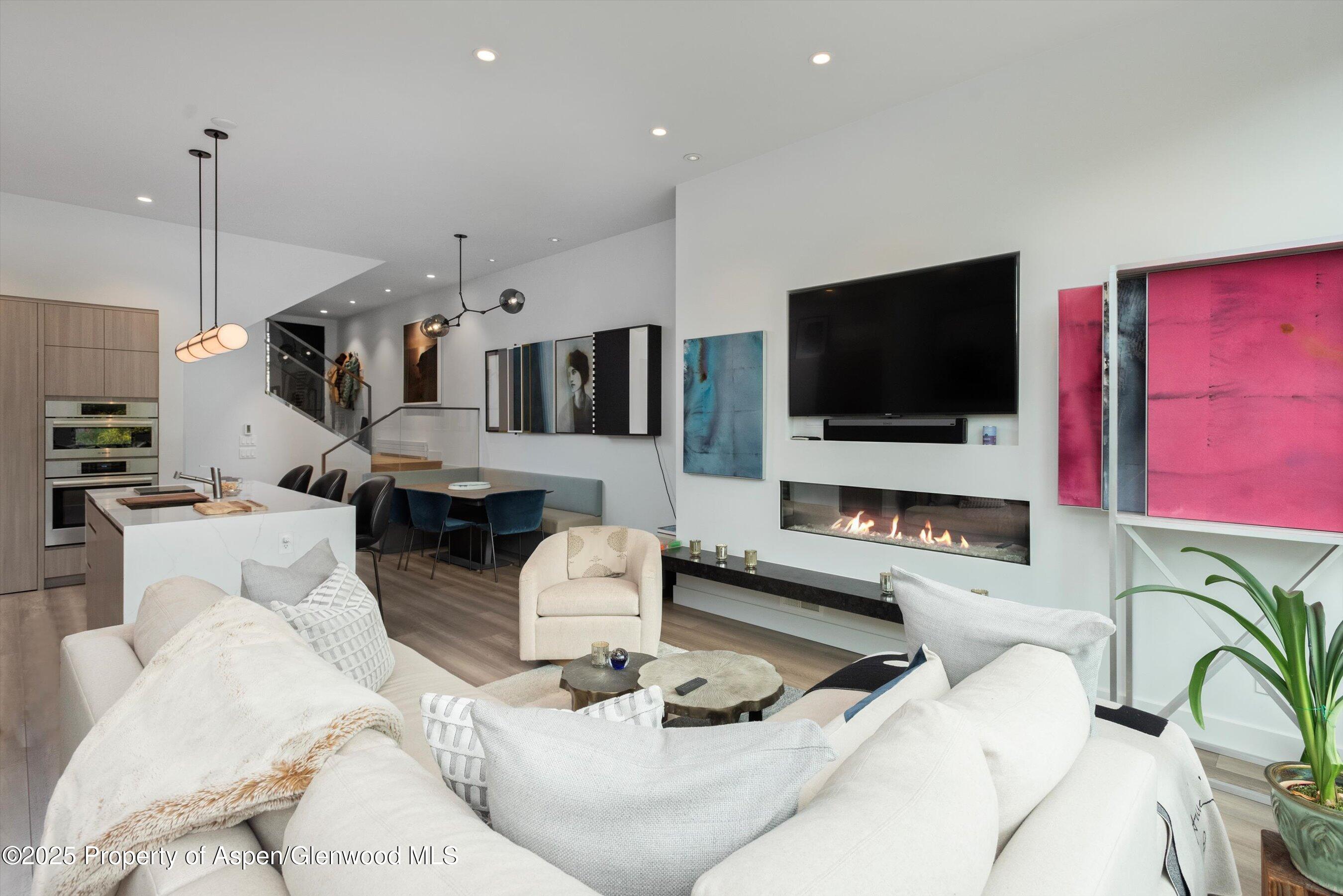 155 Lone Pine Road, Unit 8 Aspen, CO 81611 - Photo 6 of 36 a living room with furniture and a flat screen tv