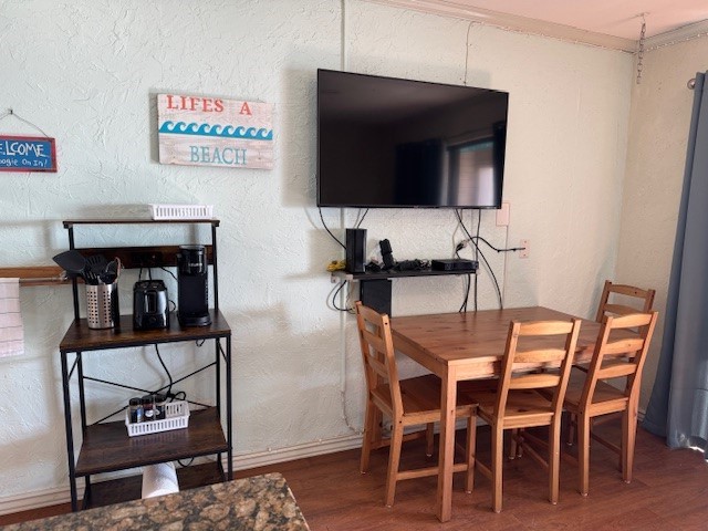 3938 Surfside Boulevard, Unit 1339 Corpus Christi, TX 78402 - Photo 5 of 13 a view of a dining room with furniture and wooden floor