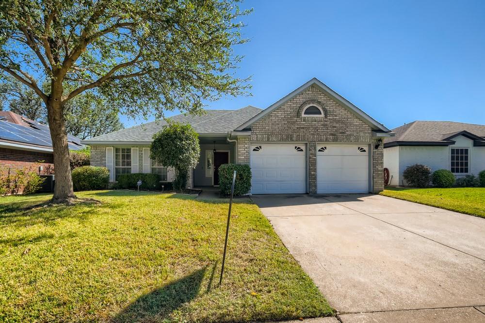1209 Princeton Place Euless, TX 76040 - Photo 1 of 1 a front view of a house with a yard