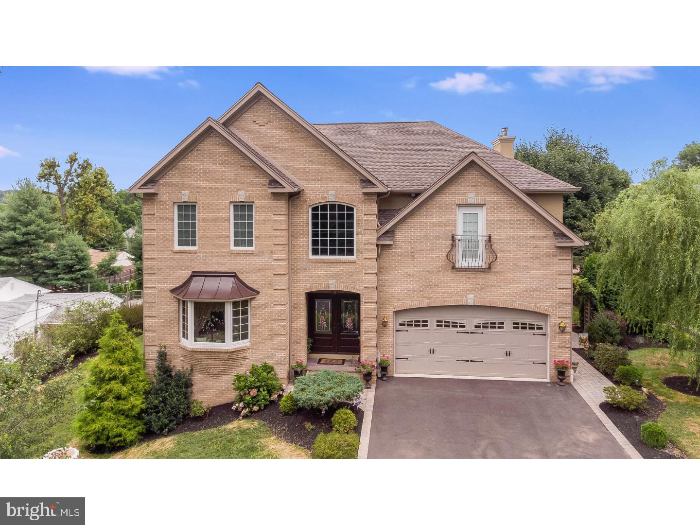 241 Shoemaker Road Huntingdon Valley, PA 19006 - Photo 1 of 25 a aerial view of a house with a yard and garage