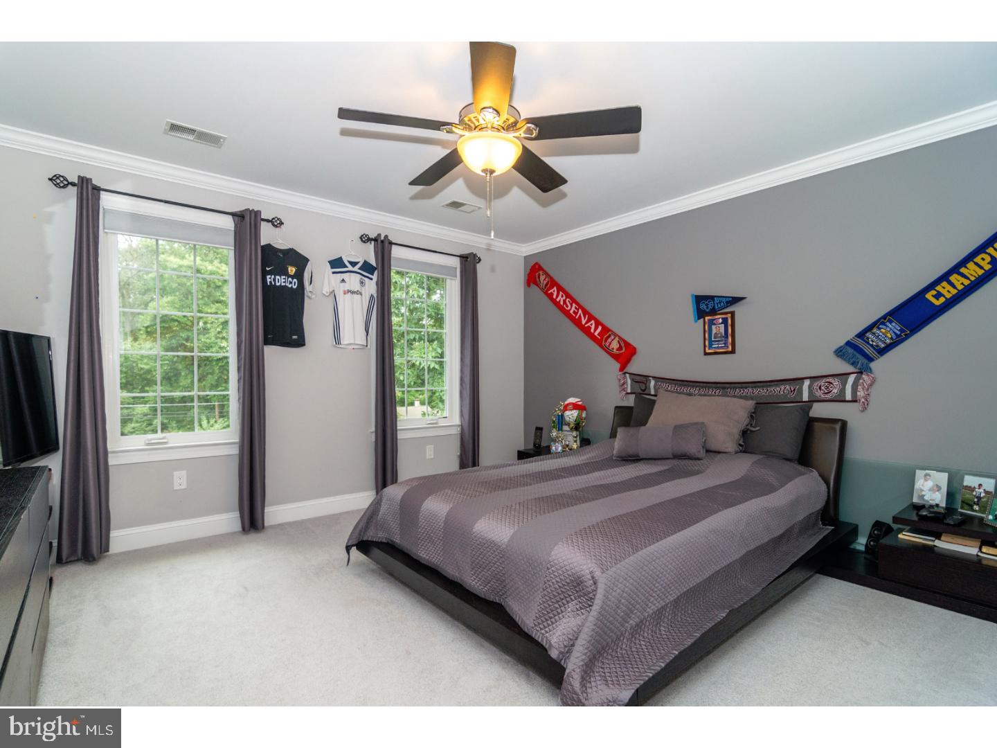 241 Shoemaker Road Huntingdon Valley, PA 19006 - Photo 13 of 25 a bedroom with a bed and a chandelier