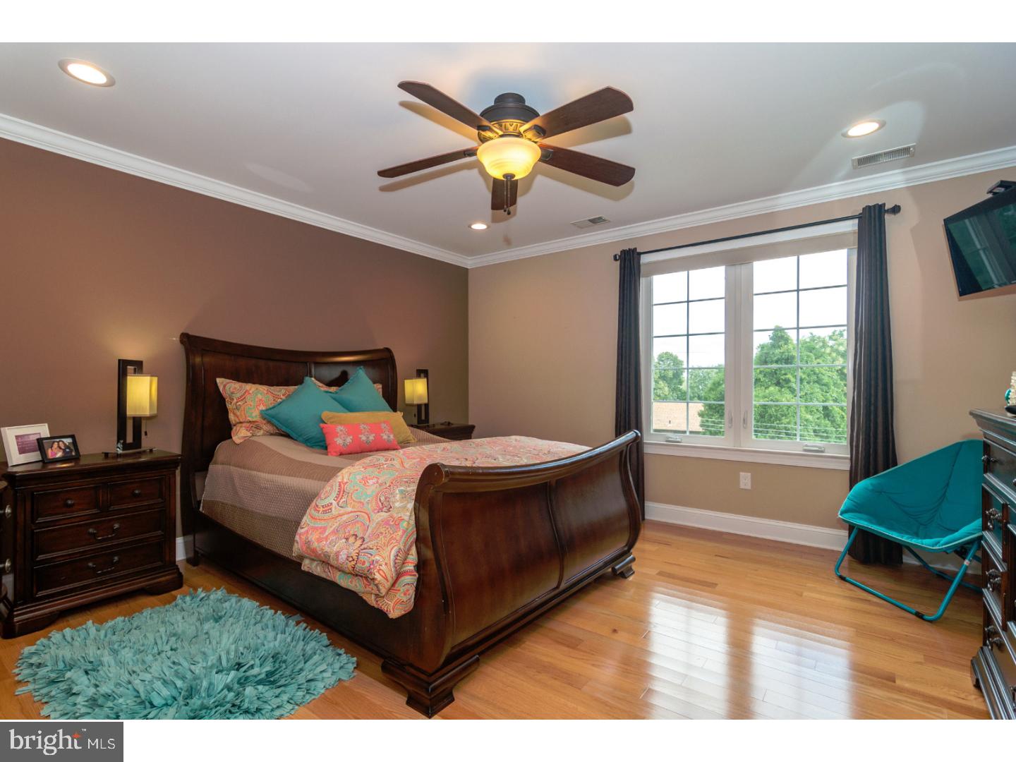 241 Shoemaker Road Huntingdon Valley, PA 19006 - Photo 14 of 25 a bedroom with a bed window and a ceiling fan