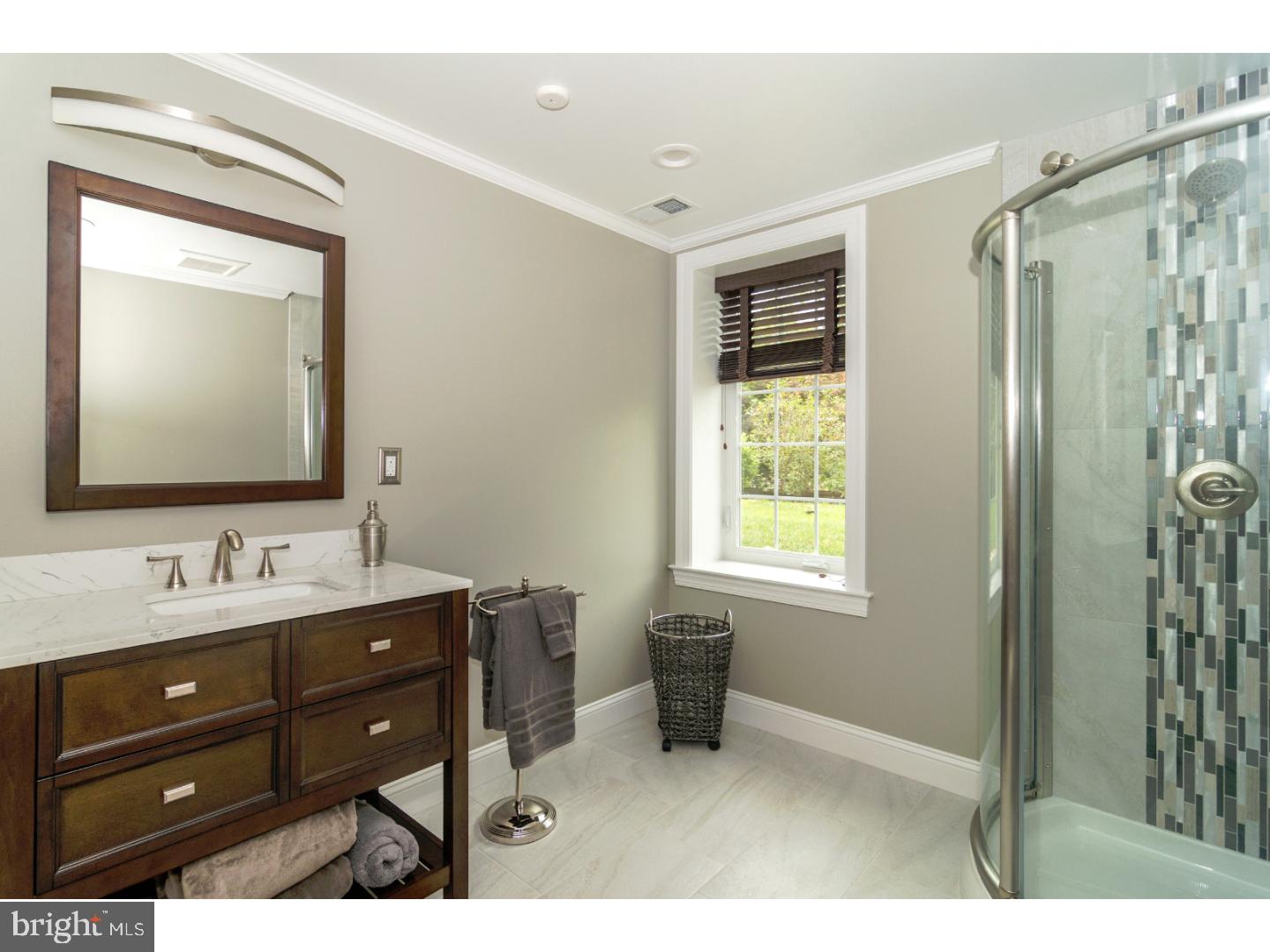 241 Shoemaker Road Huntingdon Valley, PA 19006 - Photo 22 of 25 a bathroom with a sink mirror and a bathtub
