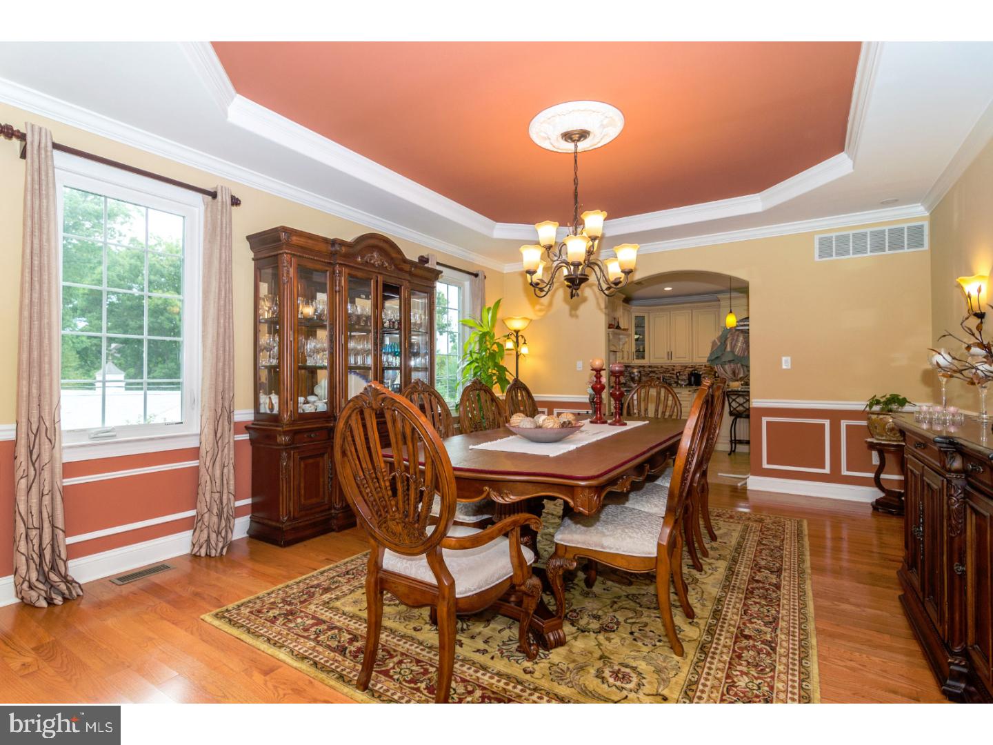 241 Shoemaker Road Huntingdon Valley, PA 19006 - Photo 6 of 25 a dining room with furniture a chandelier and wooden floor