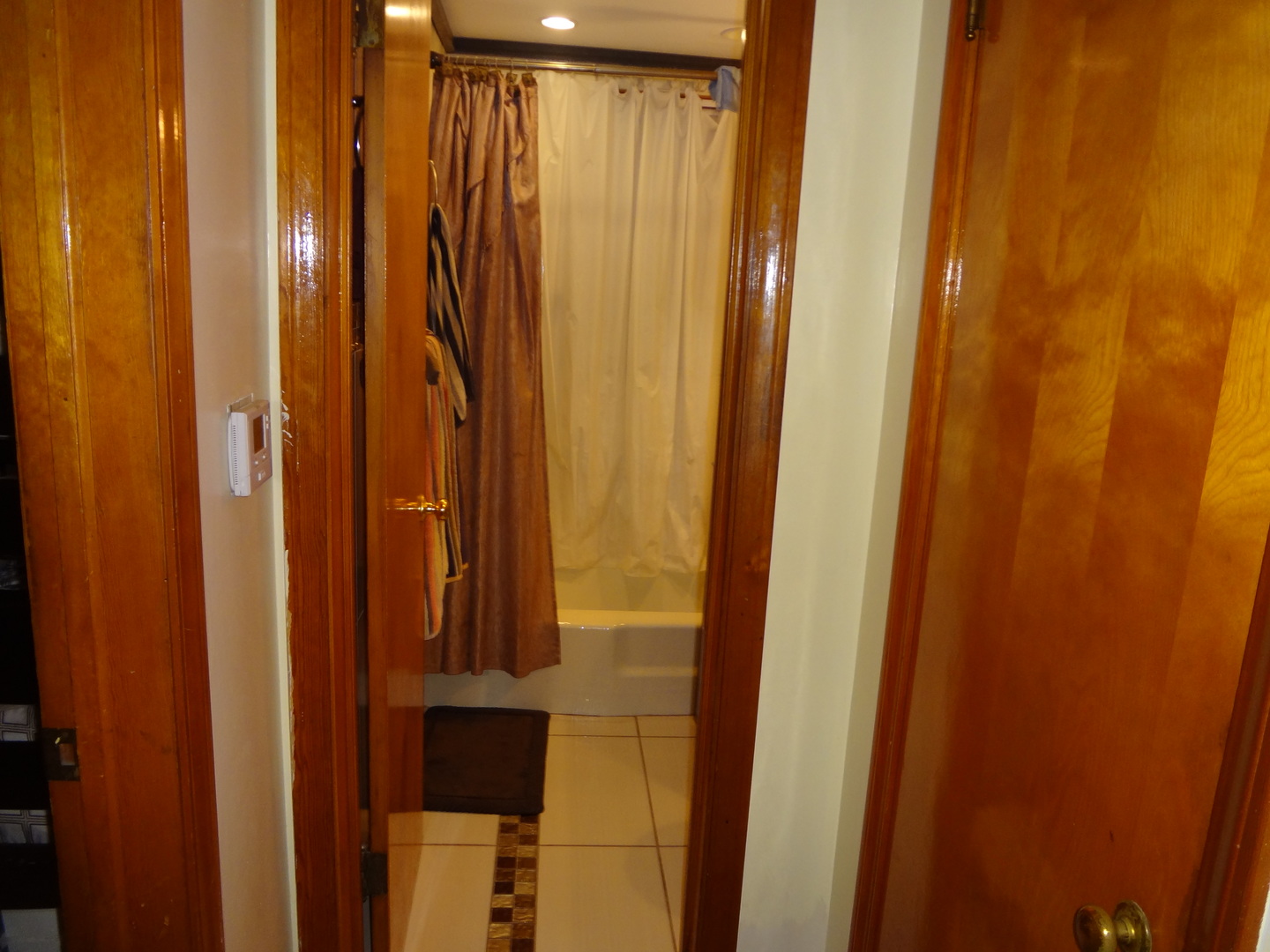 245 North Wolf Road Hillside, IL 60162 - Photo 13 of 21 a bathroom with a shower curtain and a window