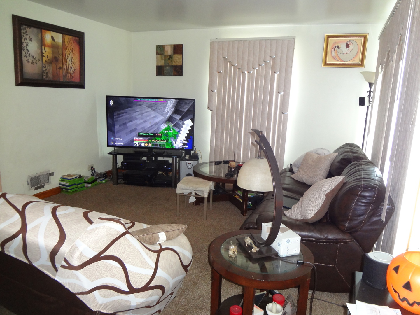 245 North Wolf Road Hillside, IL 60162 - Photo 3 of 21 a living room with furniture a window and a flat screen tv