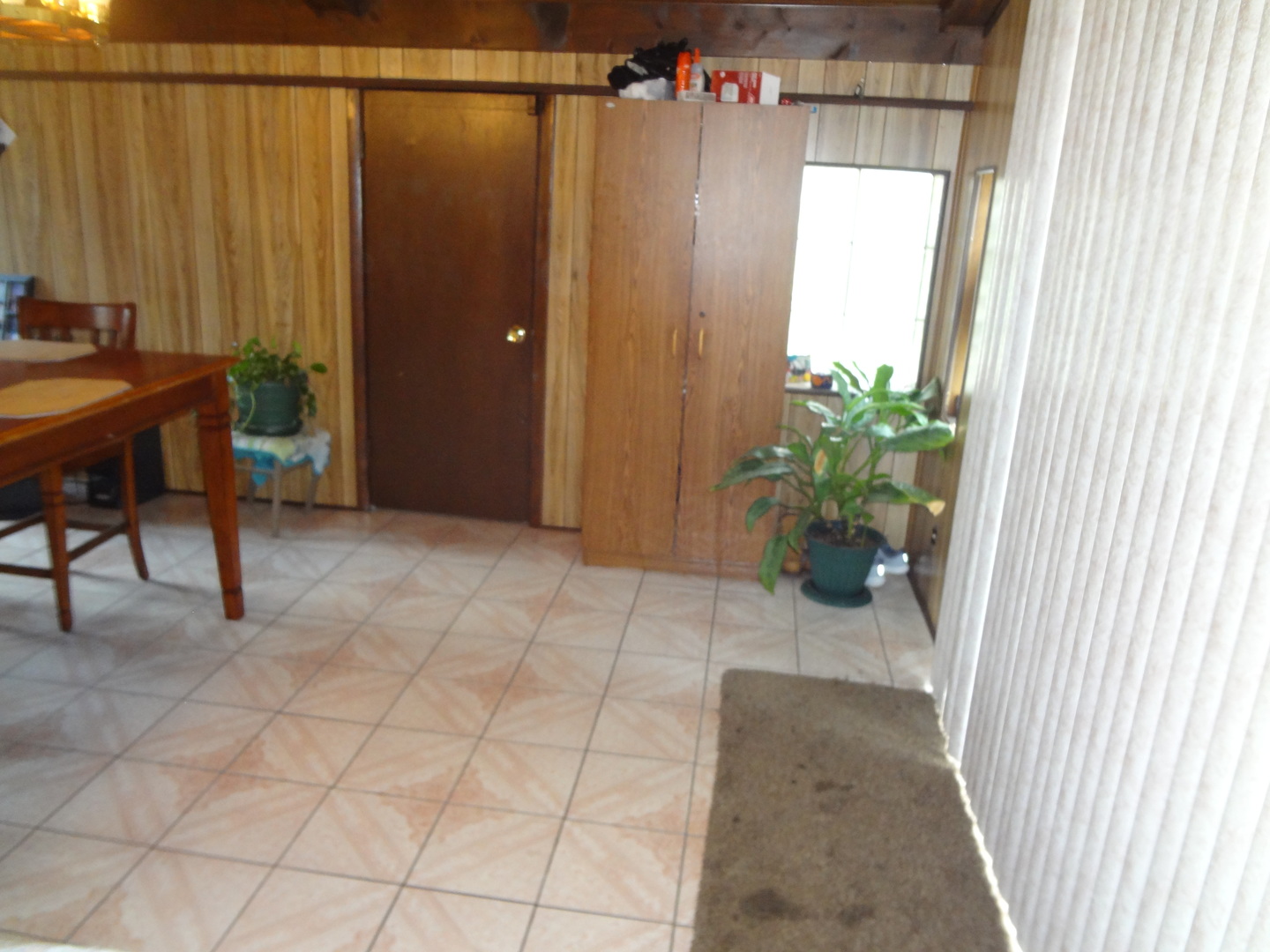 245 North Wolf Road Hillside, IL 60162 - Photo 7 of 21 a view of a room with furniture and a window