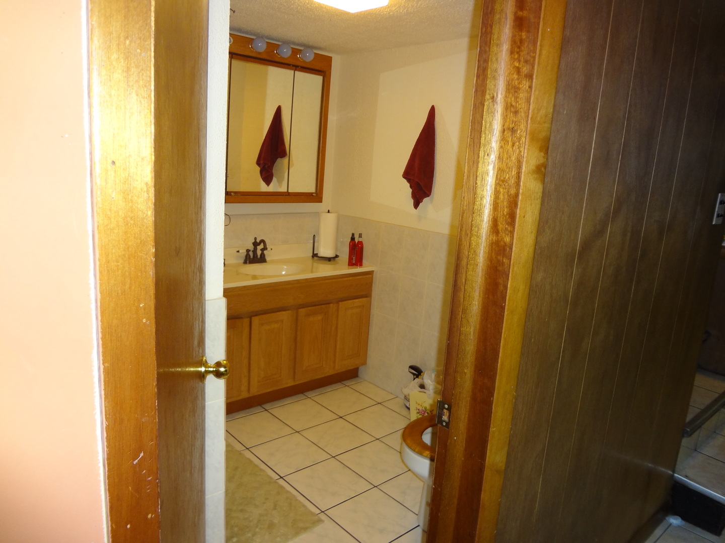 245 North Wolf Road Hillside, IL 60162 - Photo 8 of 21 a bathroom with a sink and mirror with toilet
