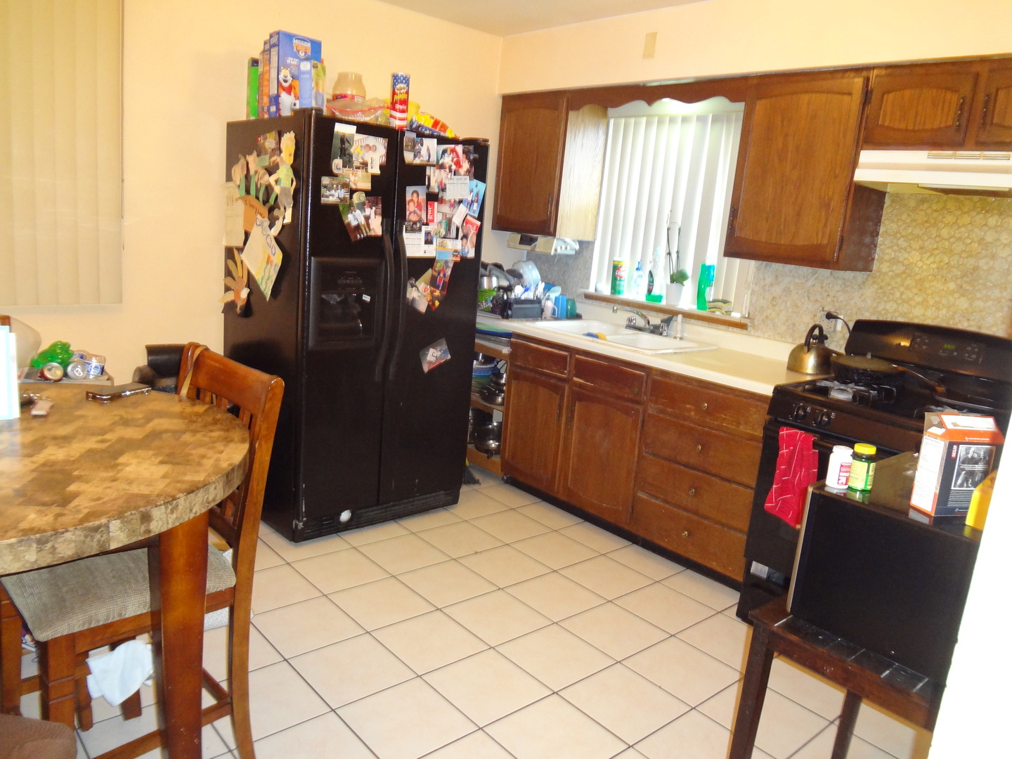 245 North Wolf Road Hillside, IL 60162 - Photo 9 of 21 a kitchen with a sink cabinets and window