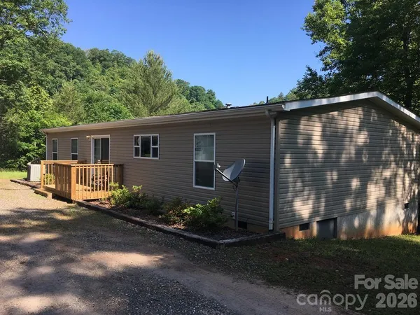 a front view of a house with yard