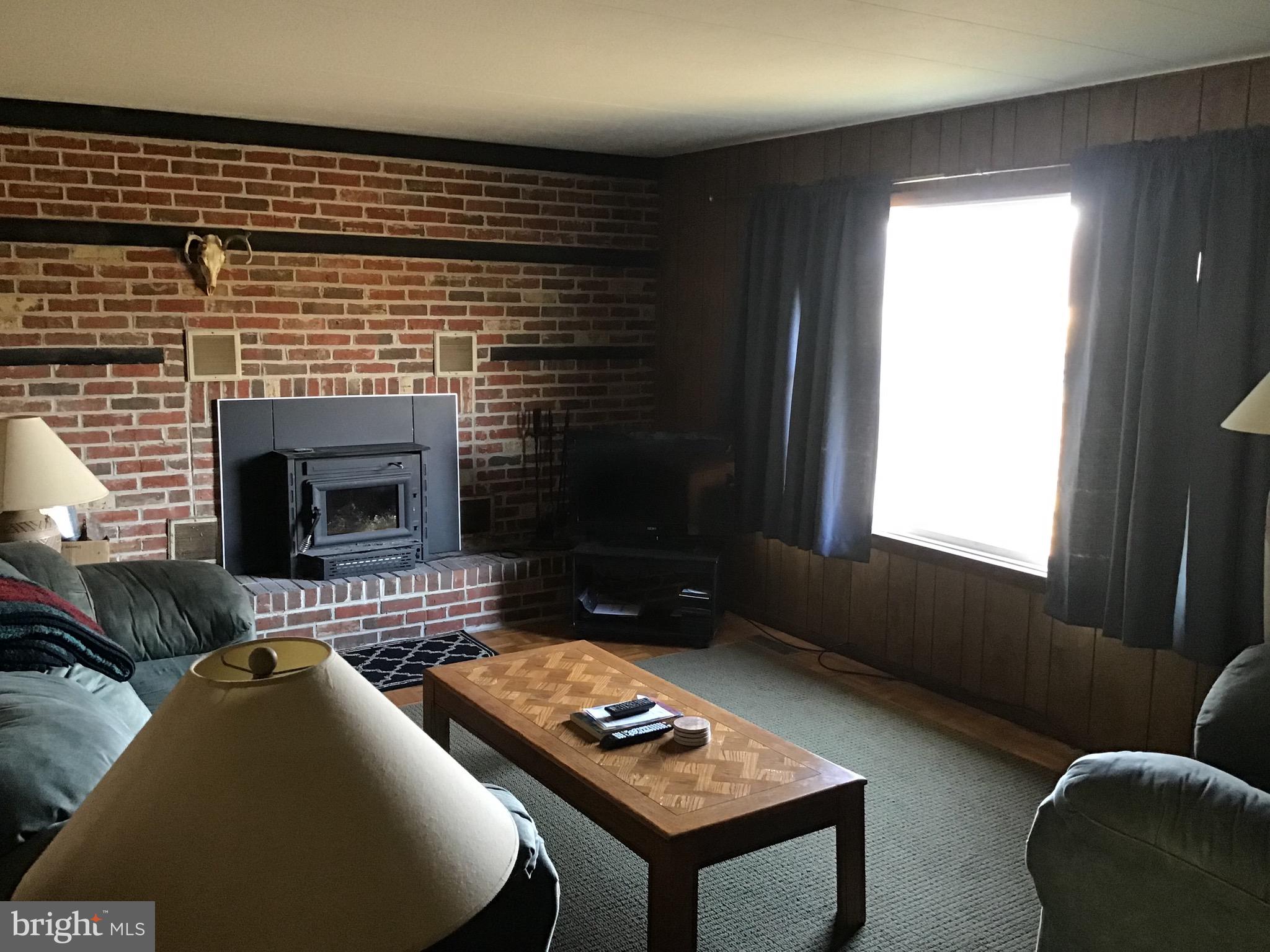 34505 Vandyke Road Galena, MD 21635 - Photo 18 of 55 a living room with furniture and a fireplace