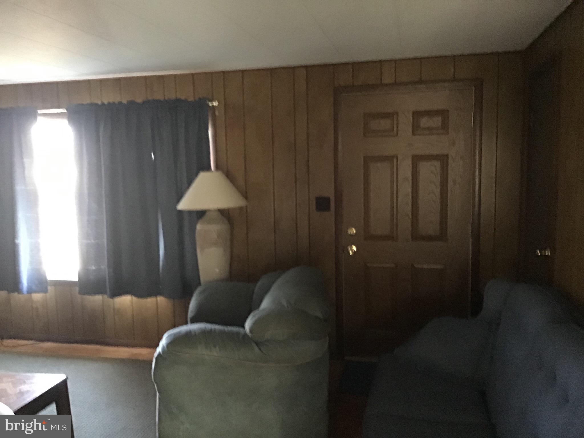 34505 Vandyke Road Galena, MD 21635 - Photo 19 of 55 a living room with furniture and a window