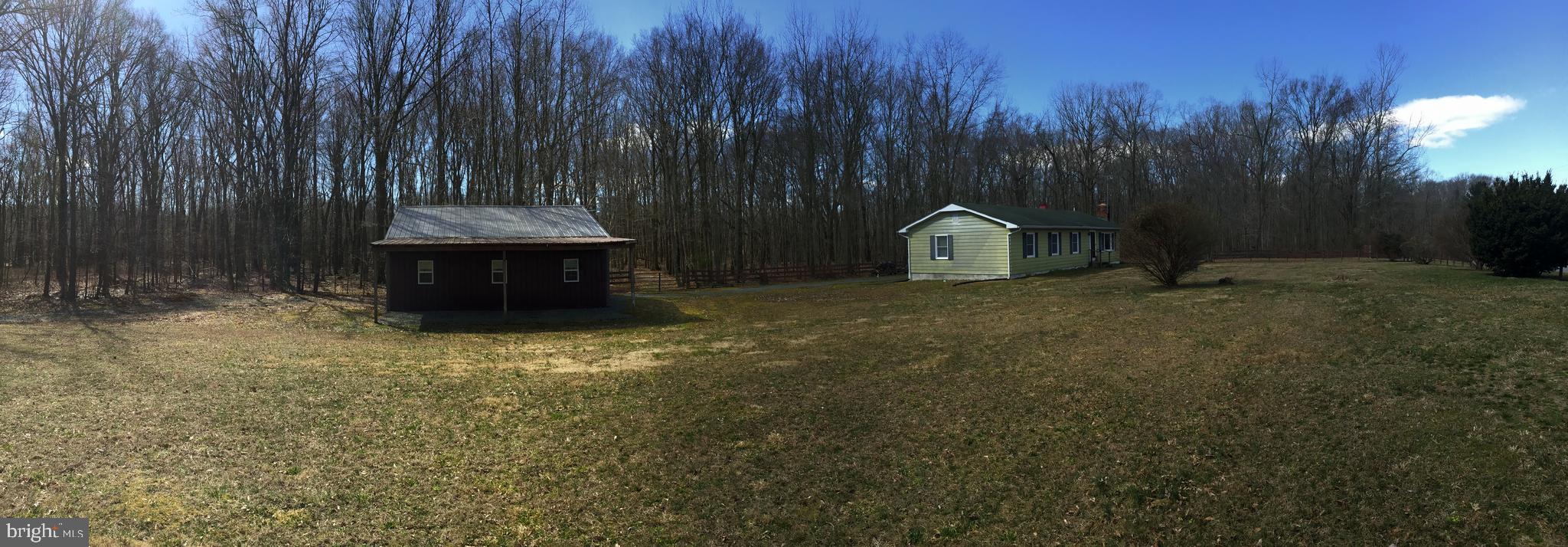 34505 Vandyke Road Galena, MD 21635 - Photo 10 of 55 a view of a tiny house with a yard and tree s