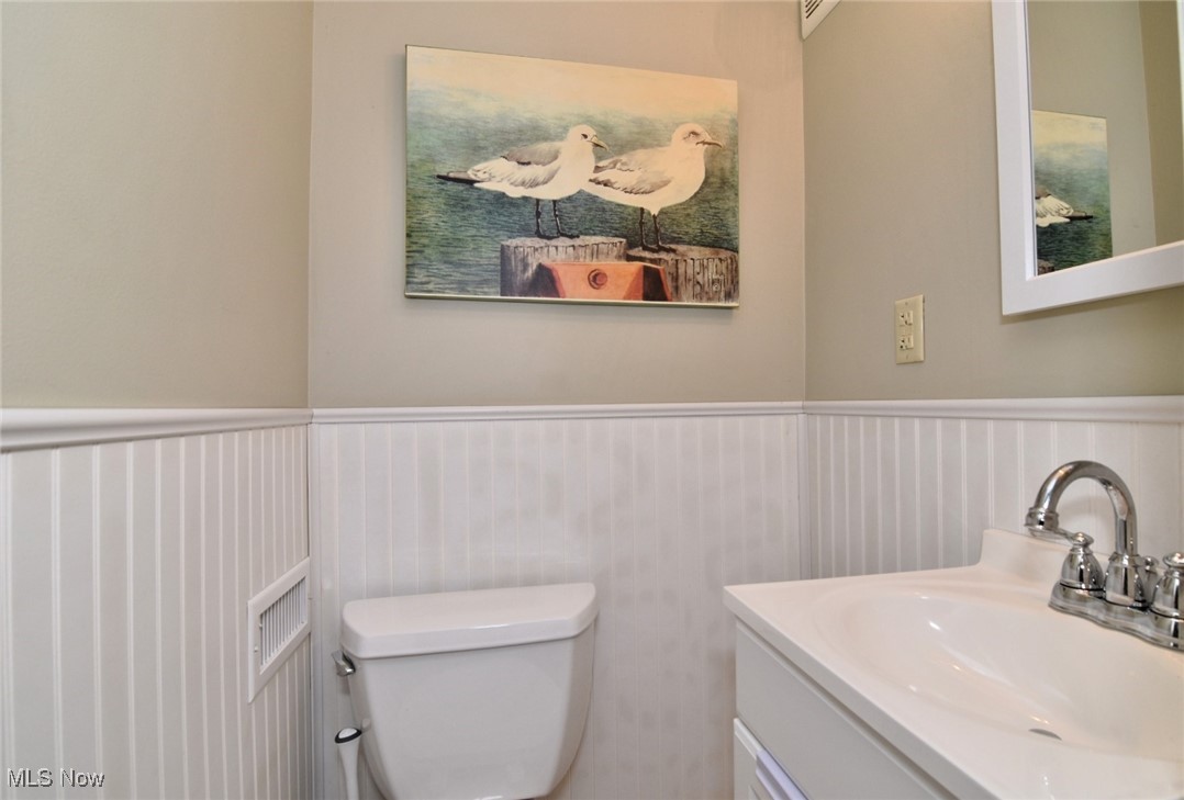 3679 Fenley Road Cleveland Heights, OH 44121 - Photo 33 of 45 Bathroom featuring wainscoting and vanity