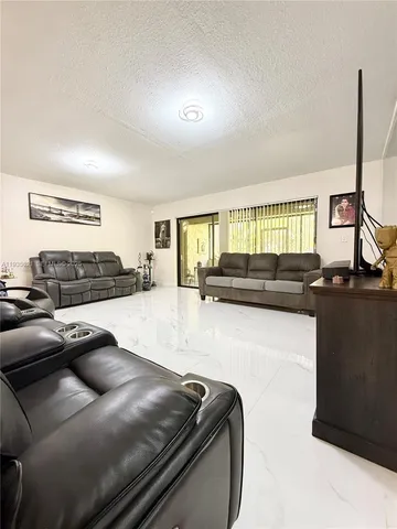 a living room with furniture window and couch