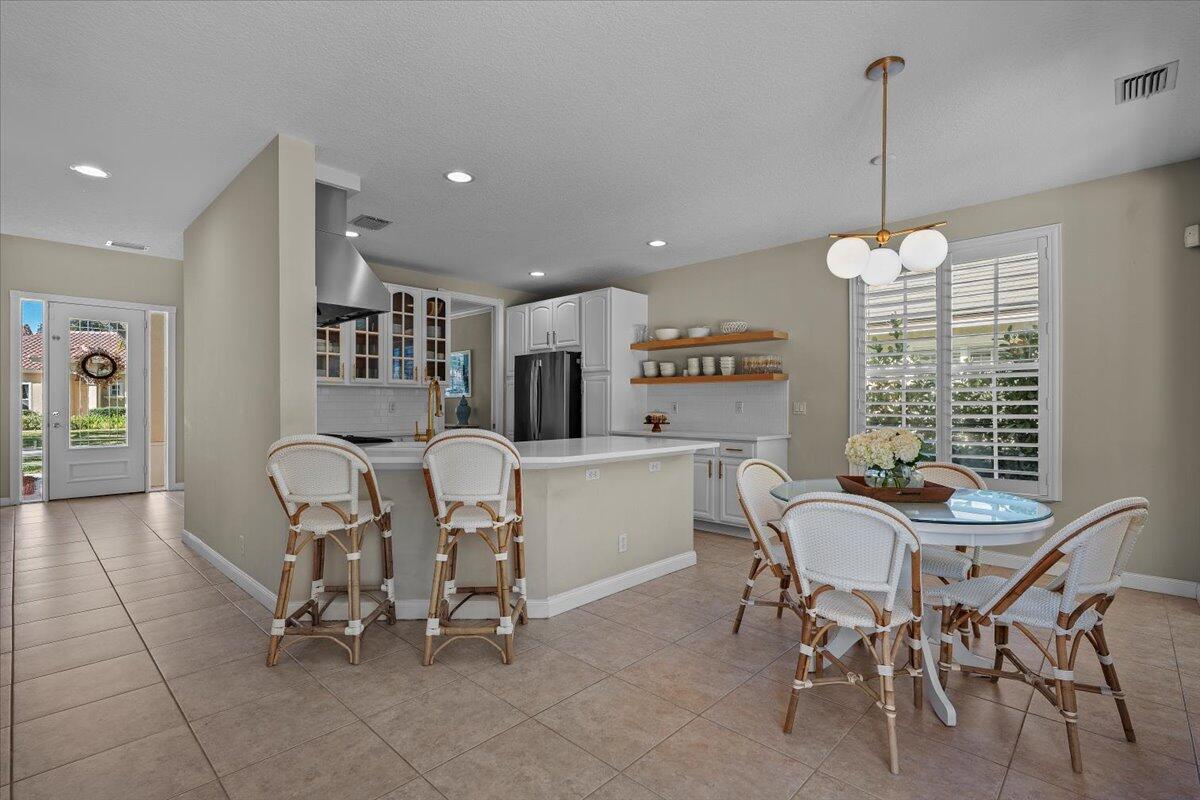 429 Oriole Circle Jupiter, FL 33458 - Photo 6 of 57 dining, kitchen facing front door
