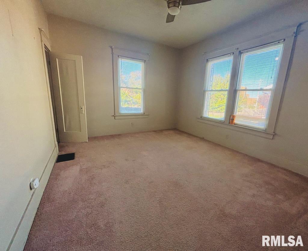 310 West Walnut Street Carbondale, IL 62901 - Photo 8 of 12 an empty room with windows