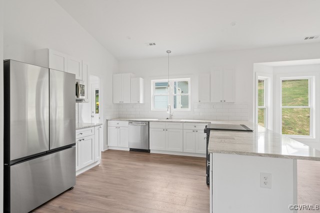 16444 Tyler Station Road Beaverdam, VA 23015 - Photo 7 of 16 Kitchen featuring vaulted ceiling, white subway ti