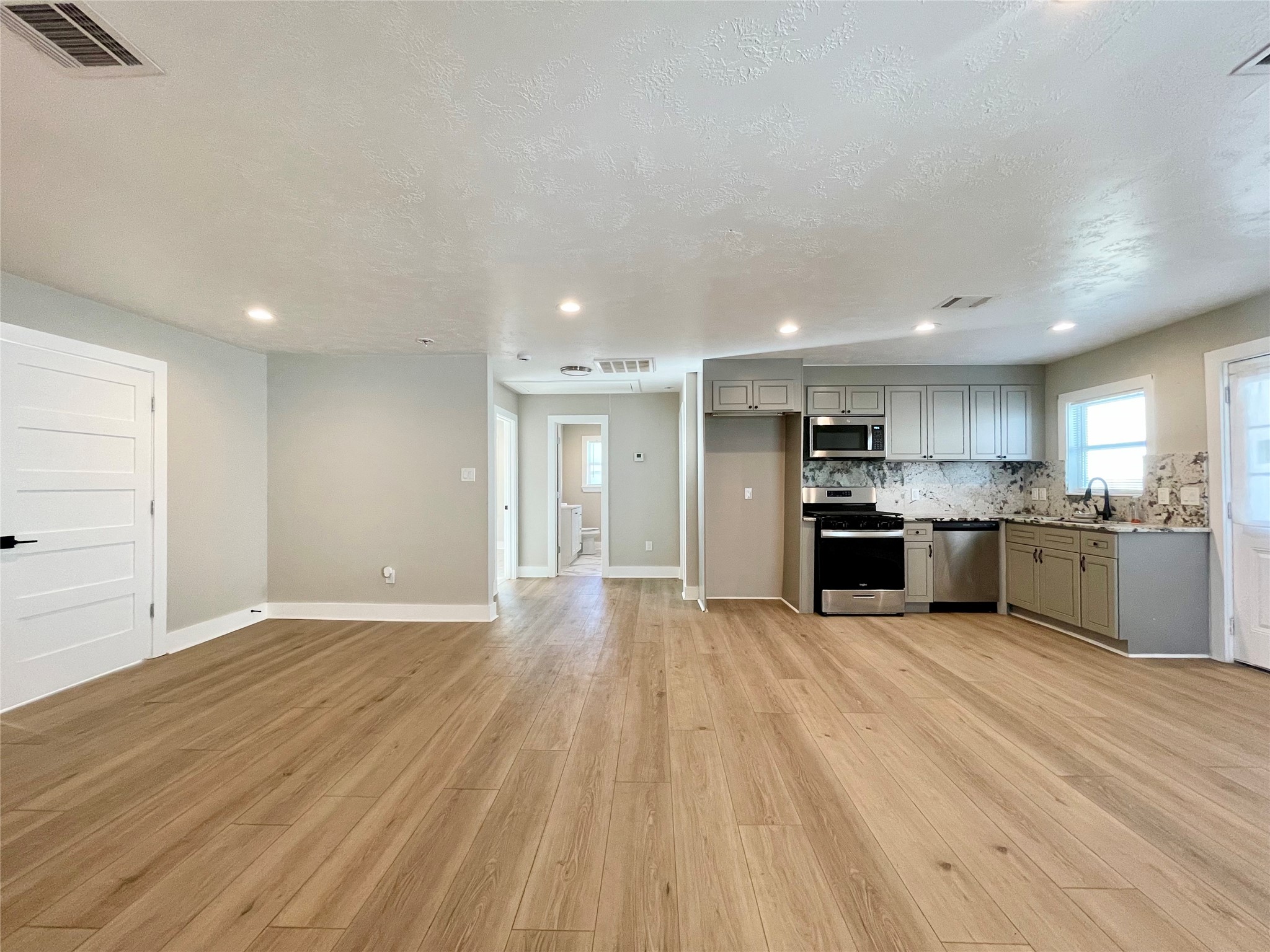 4504 Kingsbury Street Houston, TX 77021 - Photo 4 of 18 a view of kitchen with wooden floor