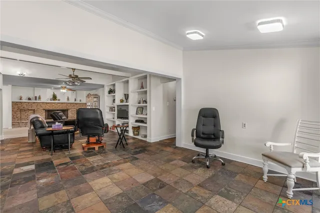 a living room with furniture and a chair