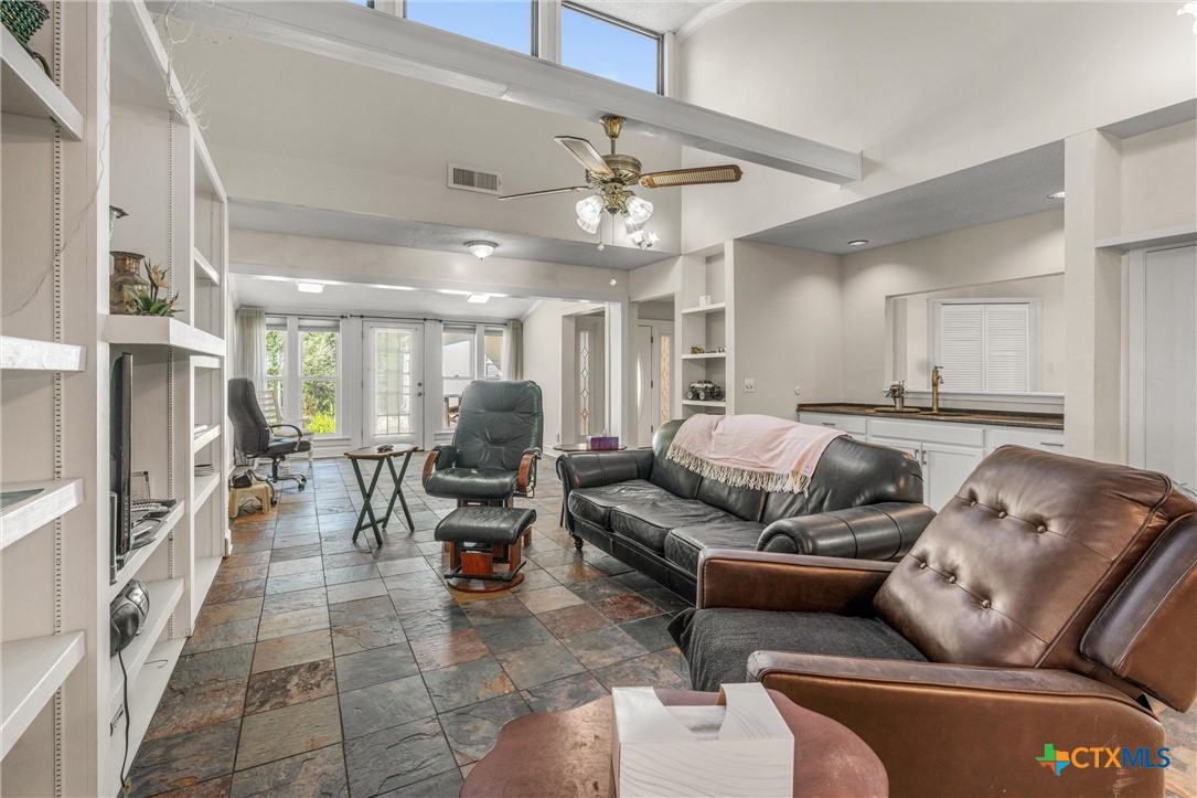 2007 O'Kelley Road Rockdale, TX 76567 - Photo 16 of 40 a living room with furniture and a chandelier