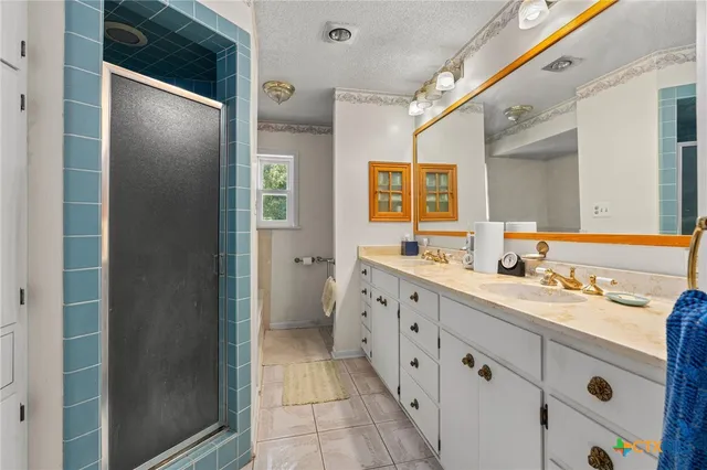 a bathroom with a double vanity sink mirror and double