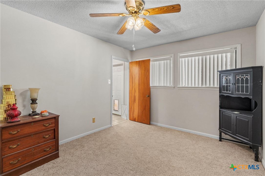 2007 O'Kelley Road Rockdale, TX 76567 - Photo 33 of 40 a view of a workspace with furniture and chandelier fan