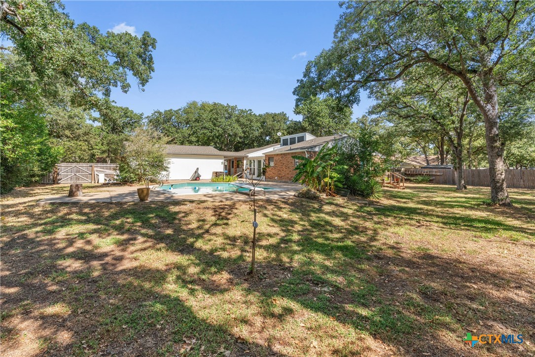 2007 O'Kelley Road Rockdale, TX 76567 - Photo 37 of 40 a view of a yard with plants and large trees
