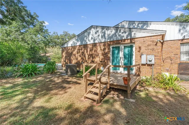 a view of a chairs and table in the patio