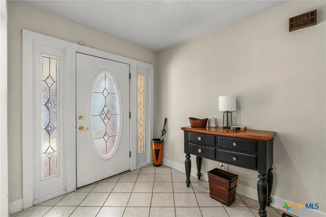 a room with a cabinets and a table