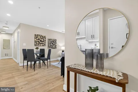 a view of dining room with furniture and wooden floor