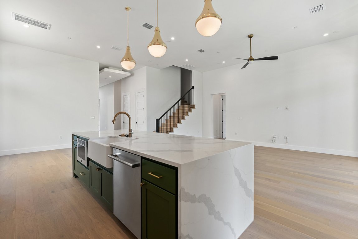 6010 Adhara Pass Austin, TX 78730 - Photo 11 of 40 a kitchen with a sink a counter space and cabinets