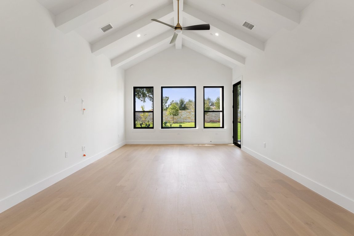 6010 Adhara Pass Austin, TX 78730 - Photo 12 of 40 an empty room with windows and ceiling fan