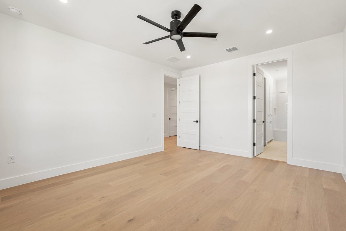 6010 Adhara Pass Austin, TX 78730 - Photo 21 of 40 an empty room with a ceiling fan and a ceiling fan