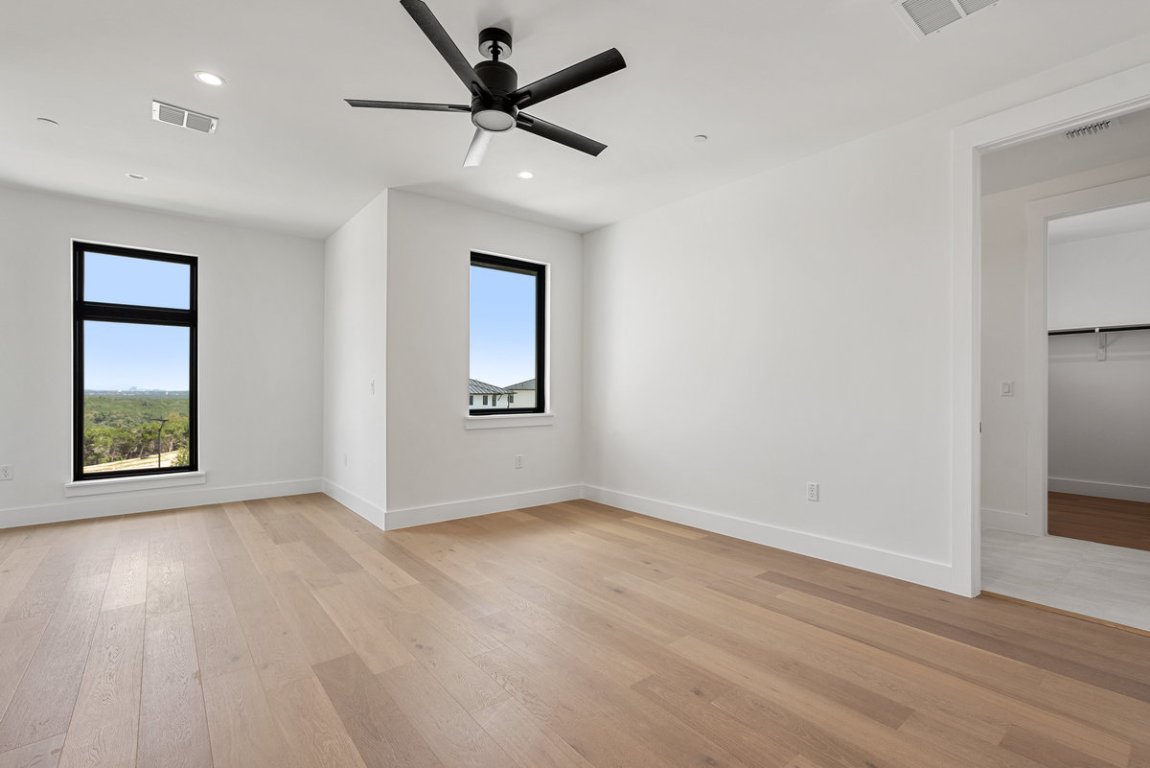 6010 Adhara Pass Austin, TX 78730 - Photo 28 of 40 wooden floor in an empty room with a window