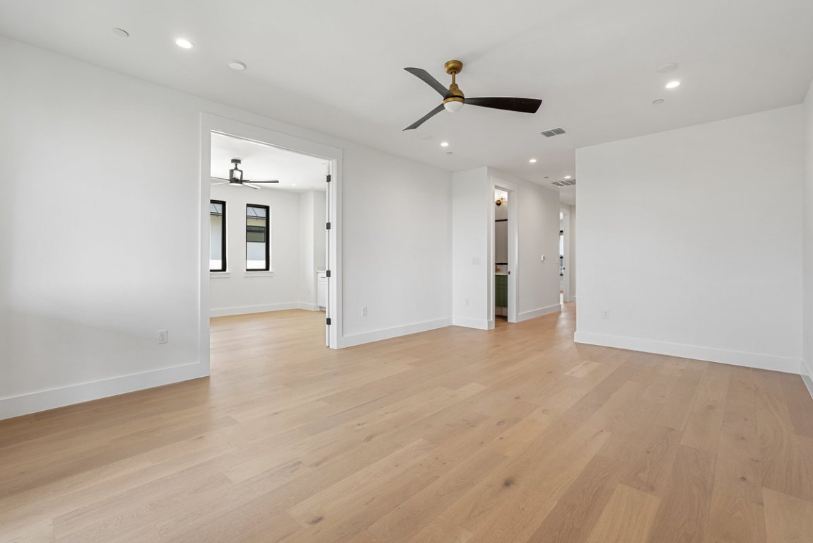 6010 Adhara Pass Austin, TX 78730 - Photo 29 of 40 an empty room with wooden floor and windows