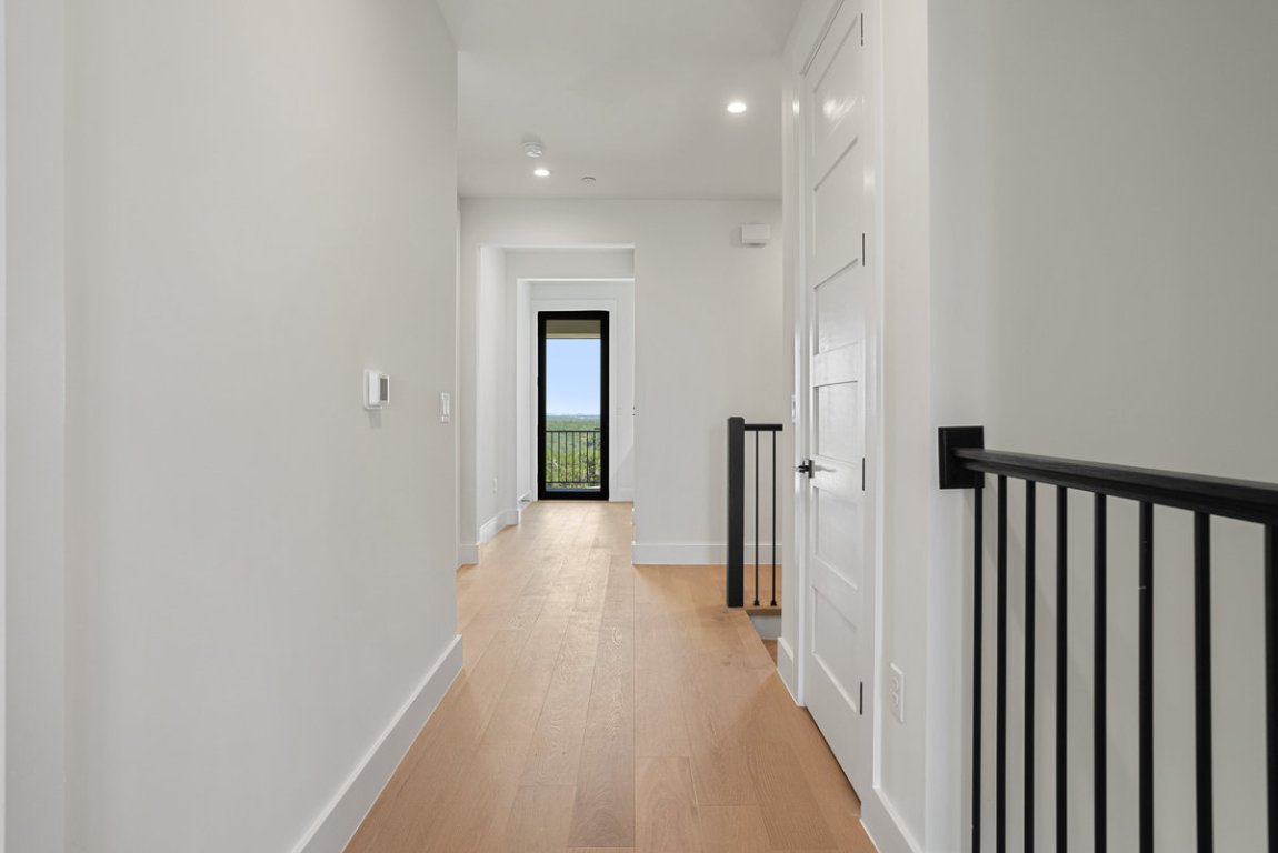 6010 Adhara Pass Austin, TX 78730 - Photo 33 of 40 a view of a hallway with a wooden floor