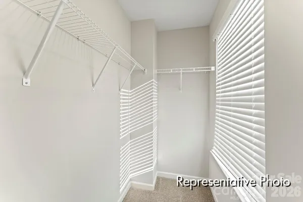 a view of a bedroom with stairs