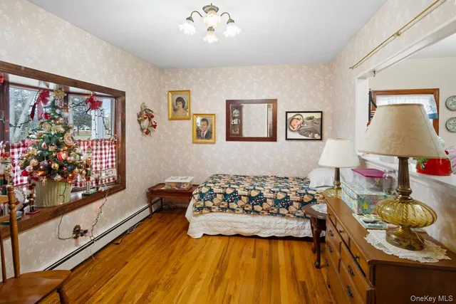 a bedroom with bed and window